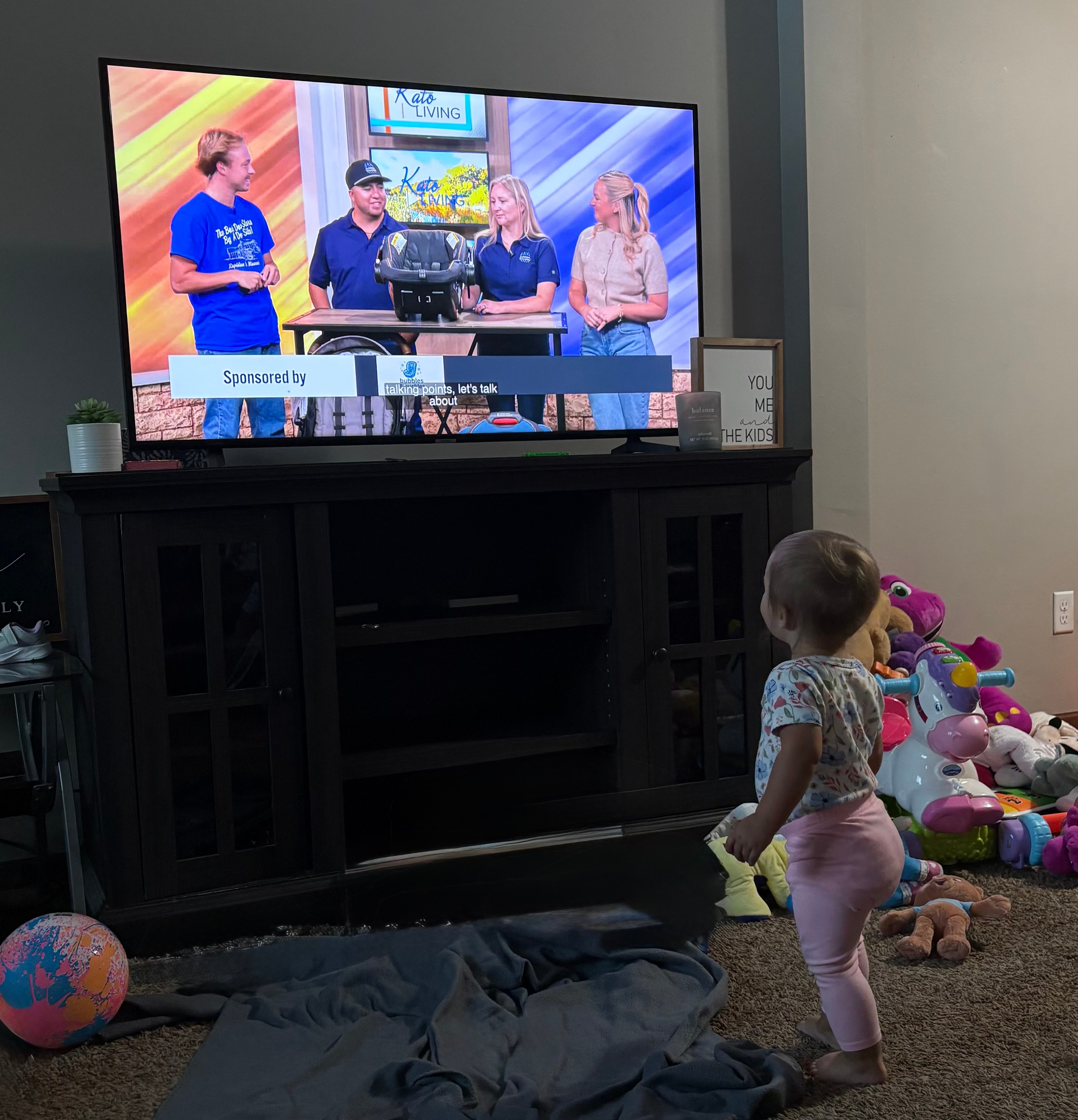 Addison at age one watching her family on Kato Living